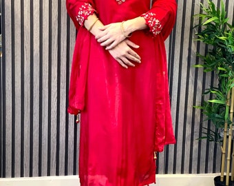 Red suit with hand work