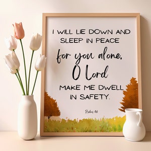 May include: A framed print with a watercolour background of a woodland scene. The print features a quote from Psalms 4:8, "I will lie down and sleep in peace for you alone, O Lord make me dwell in safety."