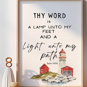 May include: A watercolour painting of a lighthouse with two smaller red houses on a rocky shore. The text "THY WORD is A LAMP UNTO MY FEET AND A light unto my path Psalm 119:105" is printed below the image.