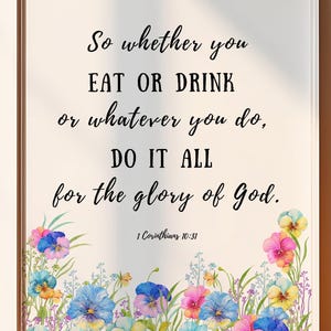 May include: A white background with a floral border of colorful pansies. The text reads "So whether you EAT OR DRINK or whatever you do, DO IT ALL for the glory of God. 1 Corinthians 10:31".