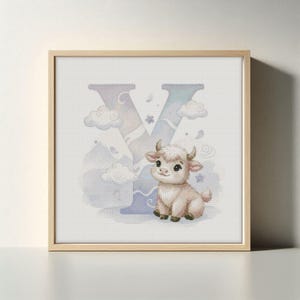 May include: A framed print featuring a watercolor illustration of the letter "Y" with a cute yak. The letter is in pastel colors with clouds and mountains. The yak is light brown with small horns and a friendly expression.