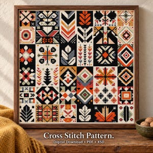 Puede incluir: Un patrón de punto de cruz cuadrado con una cuadrícula de varios motivos geométricos y botánicos en negro, blanco, naranja y azul apagado. El texto debajo dice: Cross Stitch Pattern. Digital Download • PDF • XSD. Marco de madera.