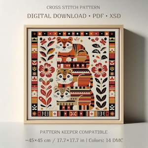 May include: A cross stitch pattern digital download featuring three stacked tigers in orange, black, and cream, surrounded by floral motifs and a geometric border. The text reads CROSS STITCH PATTERN, DIGITAL DOWNLOAD, PDF, XSD, and PATTERN KEEPER COMPATIBLE.