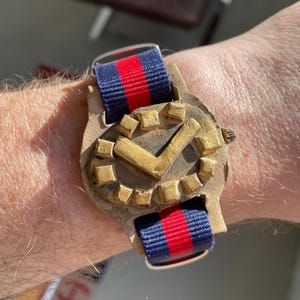 May include: A set of three ceramic mugs with a speckled, matte finish. Each mug is a different colour: light blue, cream, and grey. The mugs have a simple, modern design with a rounded shape and a comfortable handle.