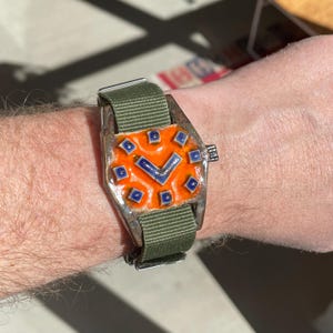 May include: A set of three ceramic mugs with a speckled, matte finish in cream, light grey, and dark grey. Each mug has a simple, minimalist design, ideal for coffee or tea.