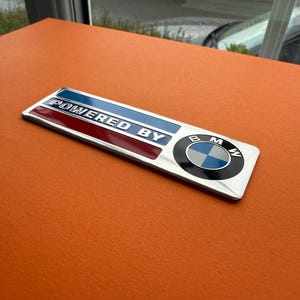 Powered by BMW” Special Emblem Badge – Motorsport Style Metal Decal – Perfect for BMW Builds
