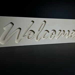 Wooden word decoration "Welcome" to place or hang on the wall.