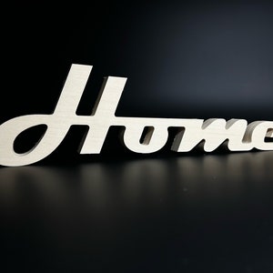 Wooden word decoration "Home" to place or hang on the wall.