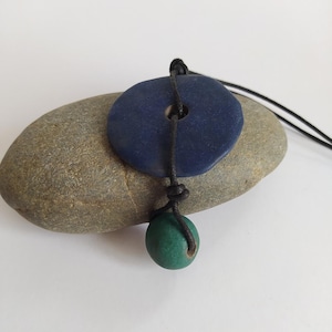 Necklace with large blue pendant