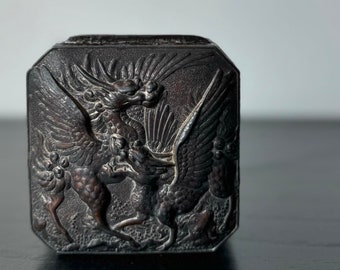 antique tin with dragon design