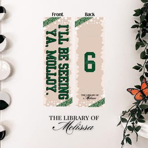 May include: A double-sided bookmark with a beige background and green accents. The front reads "I'LL BE SEEING YA, MOLLOY." The back displays the number "6." The bottom of each side says "THE LIBRARY OF Melissa."