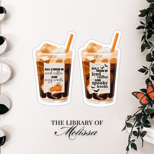 May include: Two stickers featuring iced coffee with straws. One sticker reads "All I need is iced coffee and cozy reads" with a pumpkin graphic. The other reads "All I need is iced coffee and spooky books" with bats.