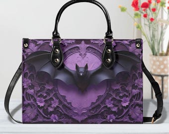 May include: A purple handbag with a black bat design. The bag features a black handle and shoulder strap. The bat is centered on the front of the bag, with its wings spread. The background has a floral pattern.