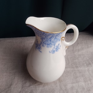 Antique Royal Worcestershire vitreous blue and white porcelain milk jug