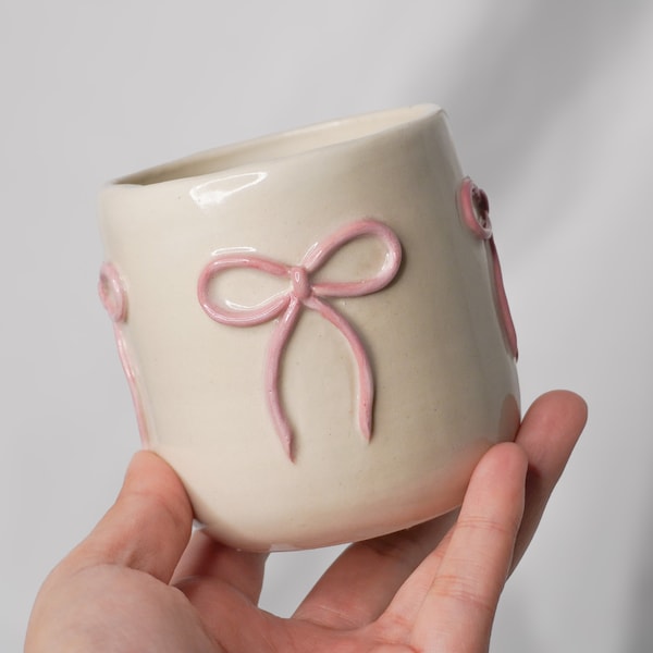handmade ceramic bow to-go coffee cup