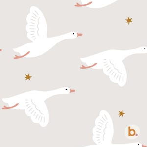 May include: A repeating pattern on a light beige background featuring white geese in flight with orange beaks and feet, interspersed with small gold stars. A small circular logo with the letter b and a pink dot appears in the bottom right corner.