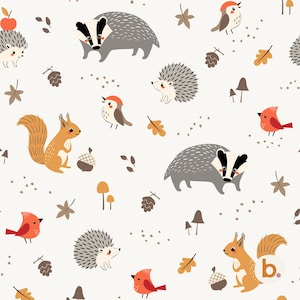 May include: A repeating pattern on a light cream background featuring illustrations of badgers, hedgehogs, squirrels, and red birds. The design includes small brown pinecones, acorns, mushrooms, and autumn leaves scattered throughout the composition.