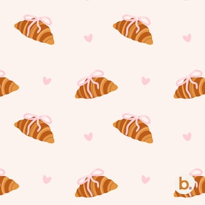 Könnte beinhalten: Ein sich wiederholendes Muster auf hellrosa Hintergrund mit braunen Croissants, die jeweils mit einer kleinen hellrosa Schleife verziert sind, durchsetzt mit kleinen hellrosa Herzen. Ein kreisförmiges Logo mit dem Buchstaben b ist in der Ecke.