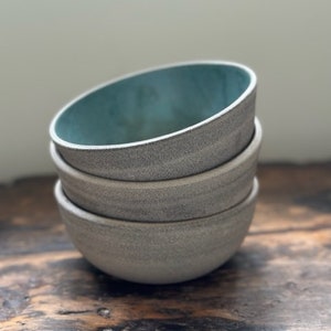 Ceramic bowls for soup or cereal or snacks in grey cement clay. Industrial design. Handmade on the pottery wheel and kiln fired.