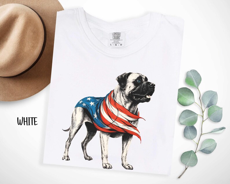 May include: White t-shirt with a graphic of a bulldog wearing an American flag bandana. The text "COMFORT COLORS" is printed on the tag.