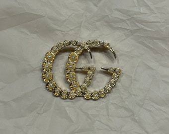 Broche de oro vintage de Gucci con perlas