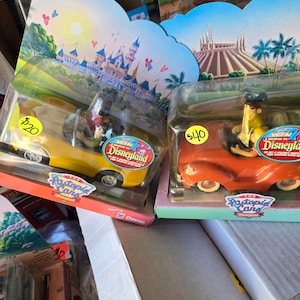Chevron cars collectibles disneyland edition 4 to choose from with people in seat