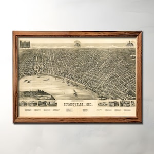 Op de afbeelding: Een vintage zwart-witte luchtfoto van Evansville, Indiana, ingelijst in een bruin houten lijst.