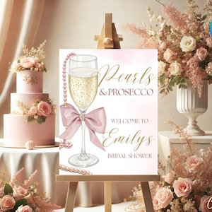 Modello di cartello di benvenuto per la festa nuziale con perle e prosecco, cartello di benvenuto per la festa nuziale con perle rosa, cartello di benvenuto per la festa nuziale con fiocco rosa
