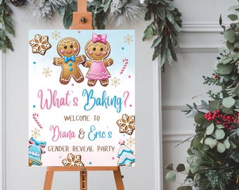 May include: A gender reveal party sign with a gingerbread couple, snowflakes, and the text "What's Baking? Welcome to Diana & Eric's Gender Reveal Party".