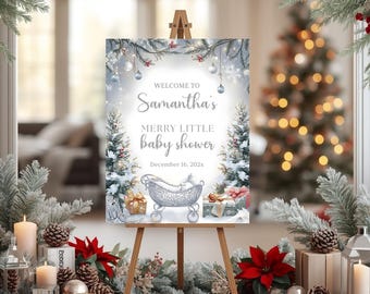 May include: A baby shower sign on an easel, decorated with winter greenery and red poinsettias. The sign reads "Welcome to Samantha's Merry Little Baby Shower" with a date. The background includes a Christmas tree and candles.