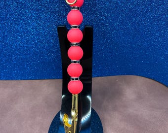 Silicone Florescent red alligator clip with black rhinestone spacers extra hand jewelry helper.