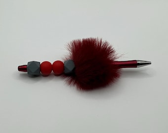 Ballpoint pen with red & gray silicone beads and fluff.