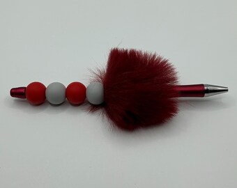Ballpoint pen with red & light gray silicone beads and fluff.