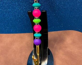 Teal & green silicone discs alligator clip extra hand jewelry helper with silicone purple + magenta rounds + black rhinestone spacers.