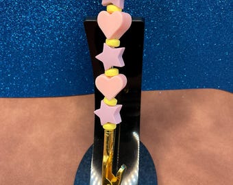 Pastel pink silicone hearts alligator clip extra hand jewelry helper with silicone pastel purple stars + yellow flat spacers.