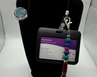 Teal and other colors mandala lanyard with black ID case and red pen casing. Dark blue and dark green silicone beads and red clay spacer