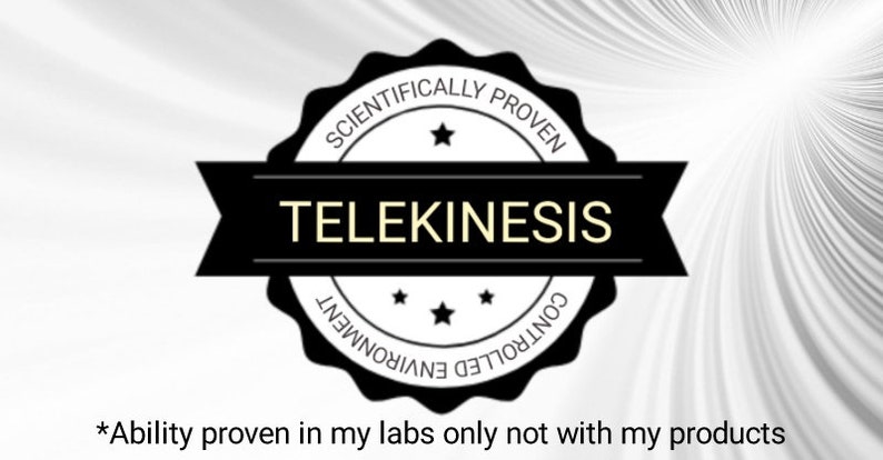 May include: A black and white seal with the text "Scientifically Proven" and "Telekinesis" in a white circle. The seal also has the text "Controlled Environment" in a white circle. The text "*Ability proven in my labs only not with my products" is below the seal.