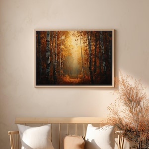May include: A framed landscape painting shows a forest path illuminated by sunlight. The artwork features tall trees with orange and brown leaves, creating a sense of depth and peace. The painting is displayed above a wooden bench with cushions.