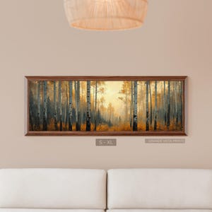 May include: A framed landscape print featuring a forest scene with tall, slender trees and a warm, golden light filtering through the foliage. The print is in a dark brown wooden frame. The text "S - XL" and "GRANDE VISTA PRINTS" are visible.