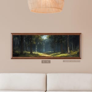 May include: A framed landscape print depicts a forest scene with tall trees and a path leading into the distance. The artwork has a brown wooden frame and the text "S - XL" and "GRANDE VISTA PRINTS".