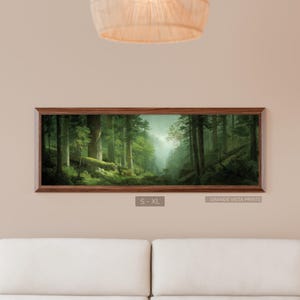 May include: A framed landscape print depicting a lush forest scene with tall trees and a waterfall in the distance. The artwork is encased in a dark brown wooden frame. The text "S - XL" and "GRANDE VISTA PRINTS" are visible.