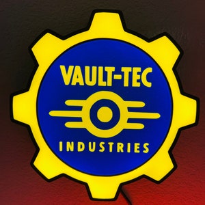 May include: A yellow and blue Vault-Tec Industries sign. The sign is shaped like a gear with the words "VAULT-TEC" and "INDUSTRIES" in yellow text on a blue background. The sign has a black outline and a power cord.