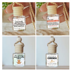 May include: A set of four small glass car air freshener bottles with wooden caps and hanging cords. Each bottle features a unique label with text including 'Smells like they declined diagnostics', 'Post-Shift Trazodone', 'Gabapentin vibes', and 'Cerenia'.