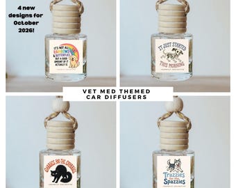 May include: Four clear glass car diffusers with wooden caps and hanging ropes. Each bottle features a unique graphic label: a golden retriever with a rainbow, a skeleton dog, a black cat, and a husky. Text includes "It's not all rainbows & butterflies", "It just started this morning", "Gabbies for the crabbies", and "Trazzies for the spazzies".