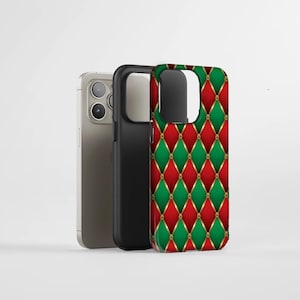 May include: Three phone cases. One is silver, one is black, and the third has a red and green diamond pattern with gold accents. The diamond pattern is reminiscent of a quilted design. The cases are displayed against a white background.