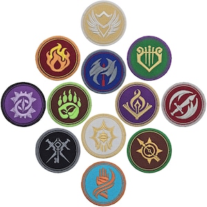 May include: Twelve round embroidered patches with various designs, including a bear paw print, a flame, a hand, a sword, and a musical note. The patches are all different colors, including purple, green, blue, red, and gold.