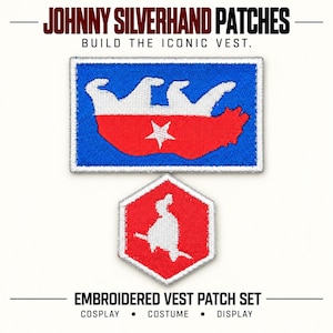 May include: Two embroidered patches labeled JOHNNY SILVERHAND PATCHES. The rectangular patch features a blue background with a white bear silhouette over a red base and a white star. The hexagonal patch is red with a white silhouette figure.