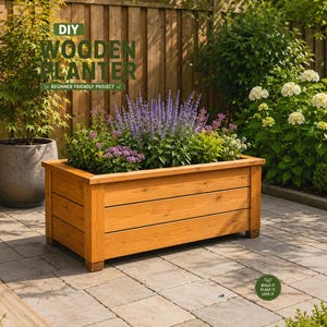 May include: A rectangular wooden planter box with horizontal slats and a natural light brown finish. The planter is filled with purple and green flowering plants. Text on the image reads: DIY WOODEN PLANTER BEGINNER FRIENDLY PROJECT and BUILD IT. PLANT IT. LOVE IT.
