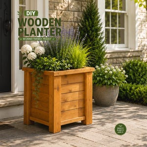 May include: A square wooden planter with horizontal slats and thick corner posts, filled with white hydrangea flowers, purple lavender, and green grasses. The text DIY WOODEN PLANTER BEGINNER FRIENDLY PROJECT is visible in the upper left corner.
