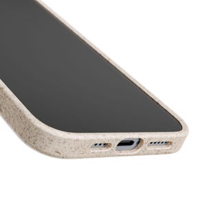 Bottom edge of bow bunny phone case showing port and button cutouts